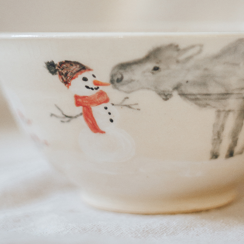 <p style="font-size: 16px; line-height: 150%;"><strong>Two Moose Meet a Snowman</strong>&emsp;<br />
small serving bowl 4&frac34;&rdquo; tall x 7&rdquo; wide<br />
<strong>$60</strong></p>